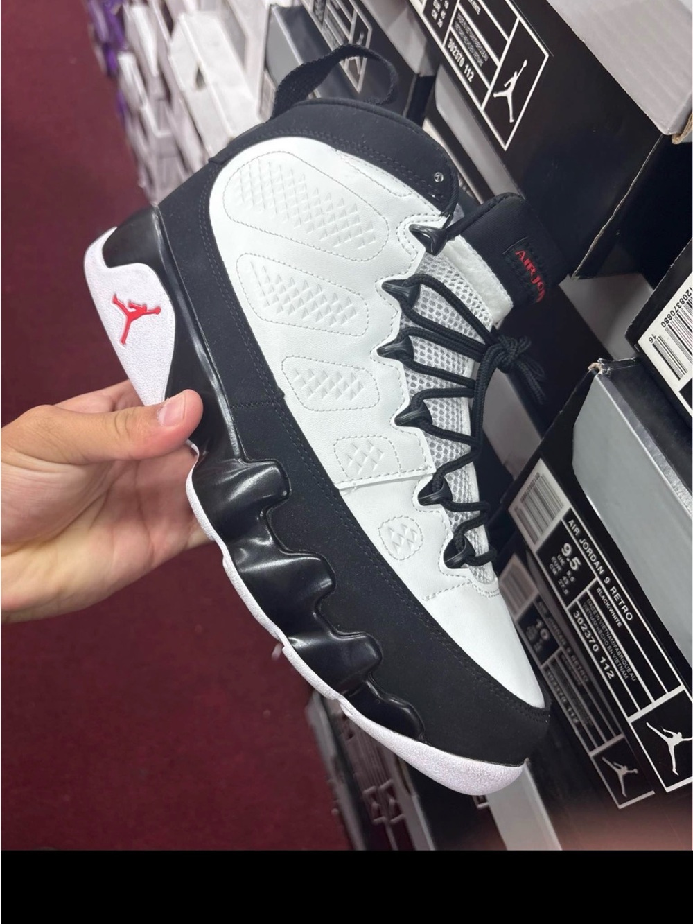 Jordan Low Top Basketball Shoe in White, Black & Red Accent